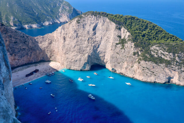 Landscape photograph of Navagio Beach (Shipwreck Beach) in Zakynthos, Greece seen from the cliff viewpoint
