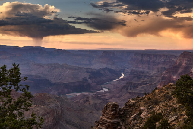 Landscape photograph of the Grand Canyon from Desert View after sunset with a storm in the background